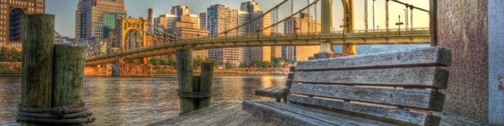 Pittsburgh skyline from the perspective of a riverwalk