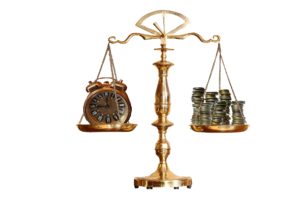 golden balance with a clock and stacks of money equally balanced