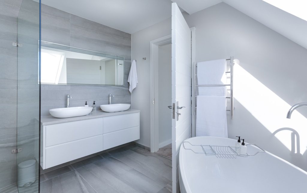 modern minimalist bathroom design with all white amenities