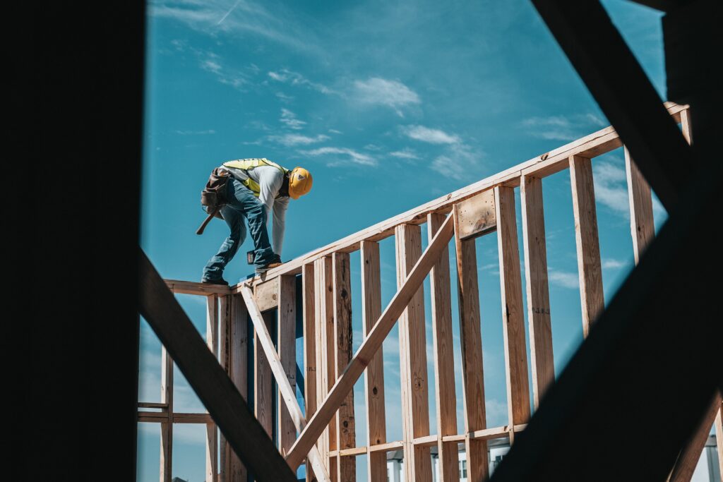 general contractor working on framing a house