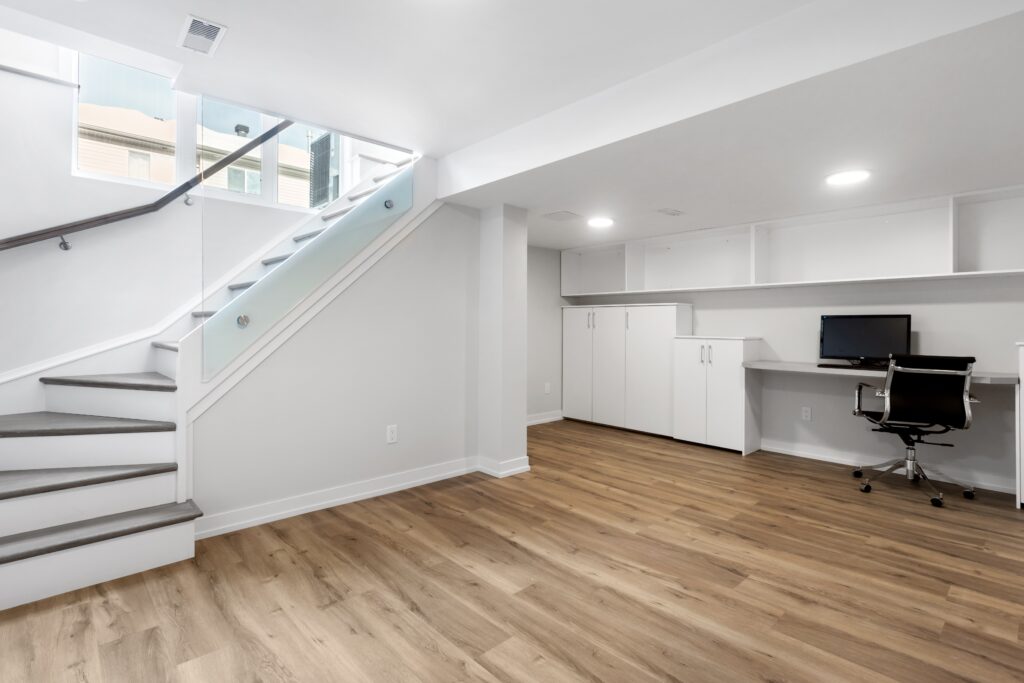 remodeled basement with new hardwood floors and paint