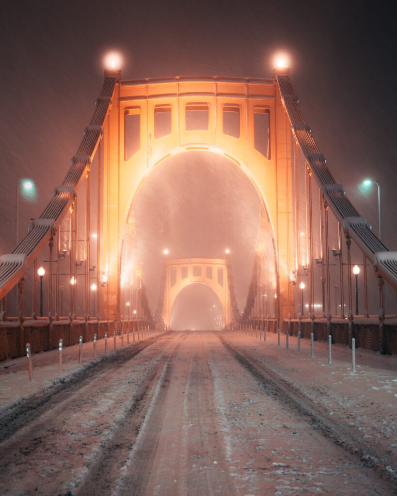 Pittsburgh winter with snow covered bridge
