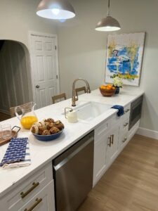 white kitchen countertop with gold hardware