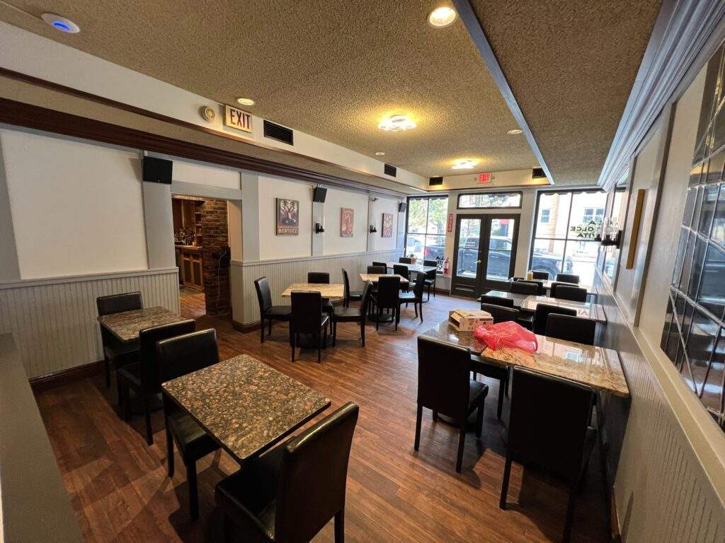 Restaurant interior with tables and chairs, showcasing commercial construction and renovations.