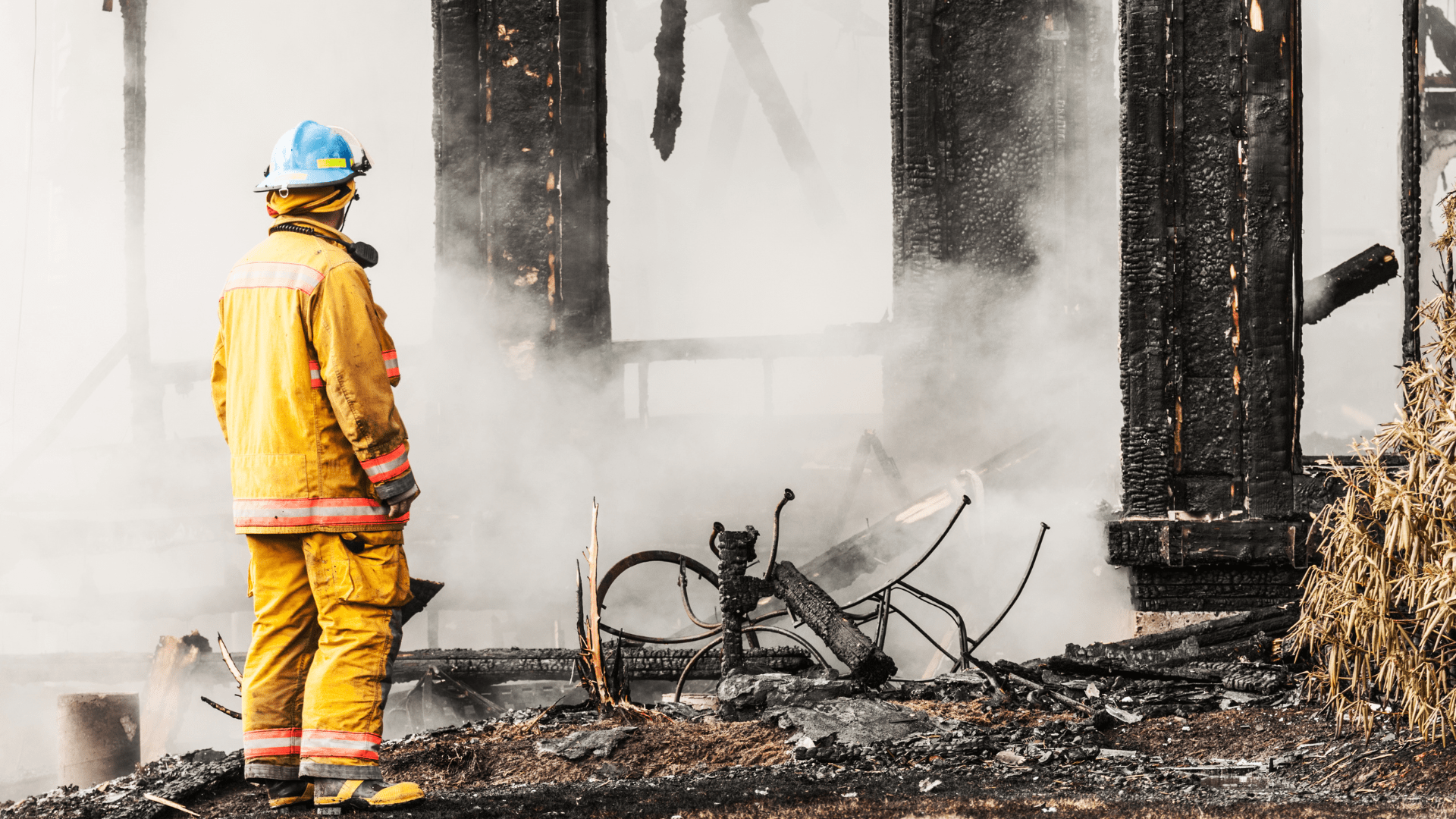 Firefighter surveys damage from fire damage mitigation and restoration in Pittsburgh.
