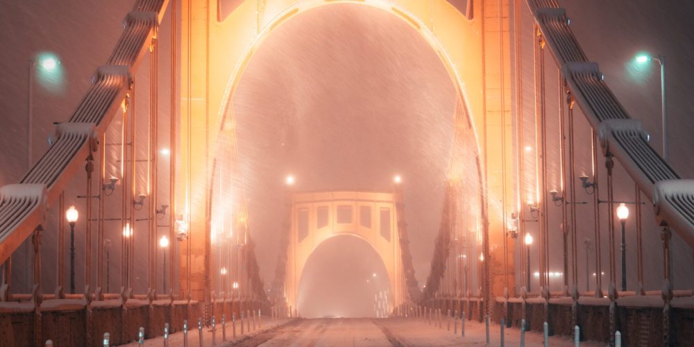 Pittsburgh winter with snow covered bridge